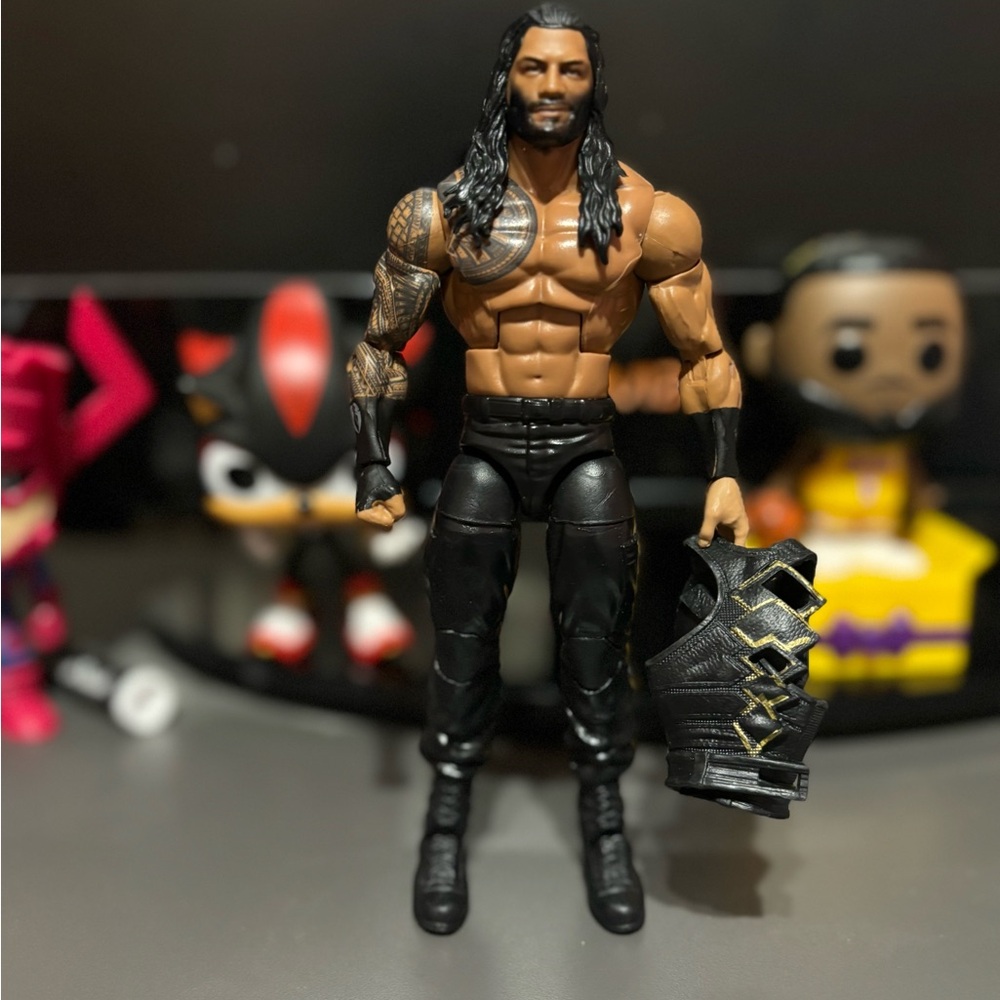 Roman Reigns elite with vest